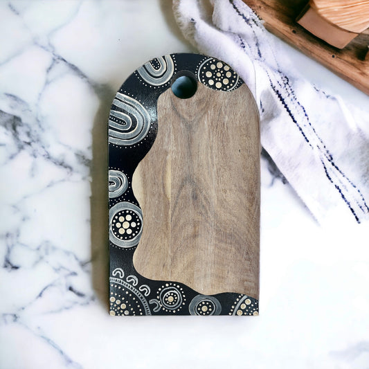 Wooden Arched Chopping Board featuring hand painted Aboriginal art by Audrey Fogg from Lil Aud's Aboriginal Art | Indigico Creative Studio